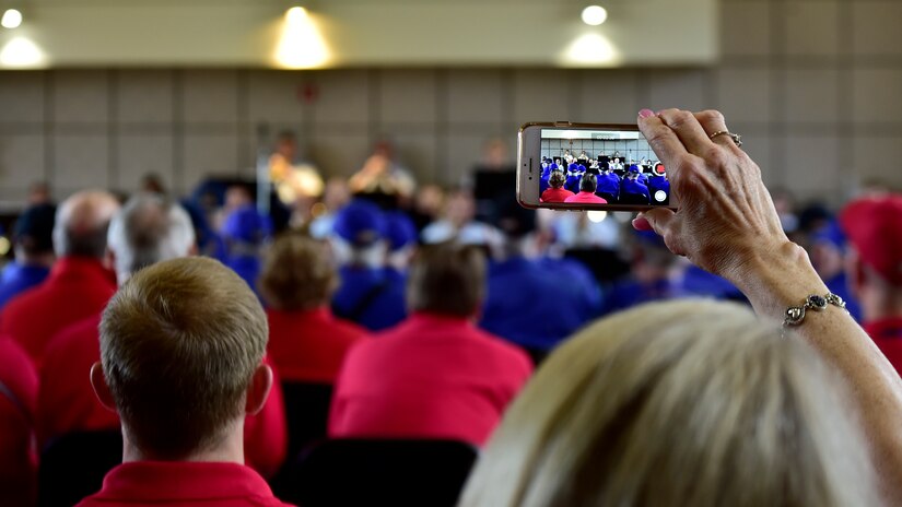 An audience member records the DFW Honor Flight performance, at Joint Base Anacostia-Bolling, April 13, 2019. The USAF Concert Band and Singing Sergeants honored military veterans from WWII, Vietnam and Korean War by playing music from the era. (U.S. Air Force photo by Staff Sgt. Cary Smith)