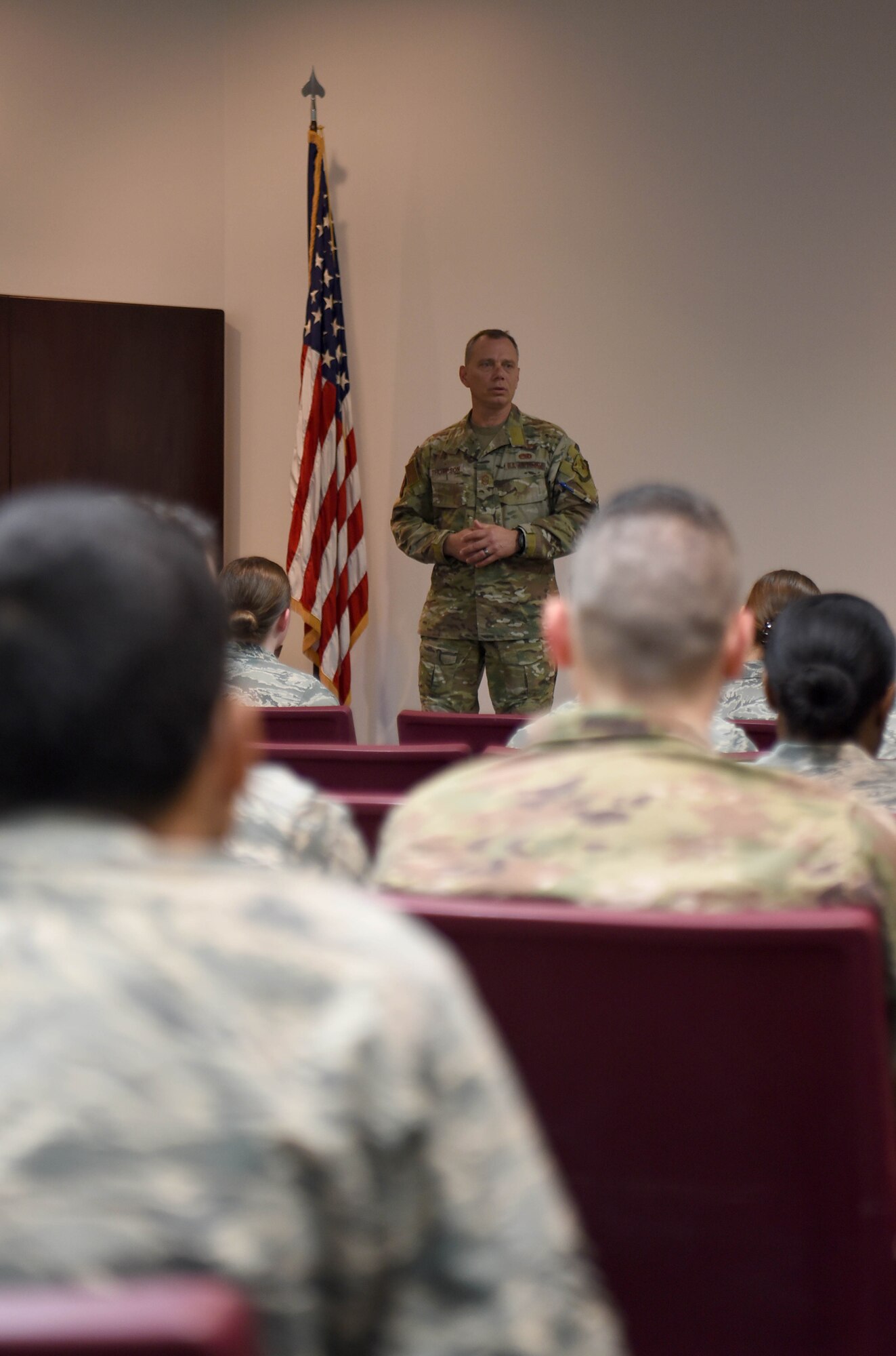 The 19th Air Force Command Chief Master Sgt. Erik Thomson speaks during an enlisted all call April 8, 2019, on Columbus Air Force Base, Mississippi. The visit was the first time Thomson had seen Columbus AFB and he said he was glad to have the opportunity to see and meet the Airmen of the pilot training wing firsthand. (U.S. Air Force photo by Airman 1st Class Keith Holcomb)