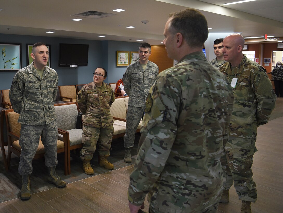 Senior Airman Kevin Morgan, 14th Medical Operations Squadron bioenvironmental technician, speaks with 19th Air Force Command Chief Master Sgt. Erik Thomson April 8, 2019, on Columbus Air Force Base, Mississippi. Morgan was coined by Thomson for his actions assisting people involved in a car accident and his consistent excellence in his career field. (U.S. Air Force photo by Airman 1st Class Keith Holcomb)