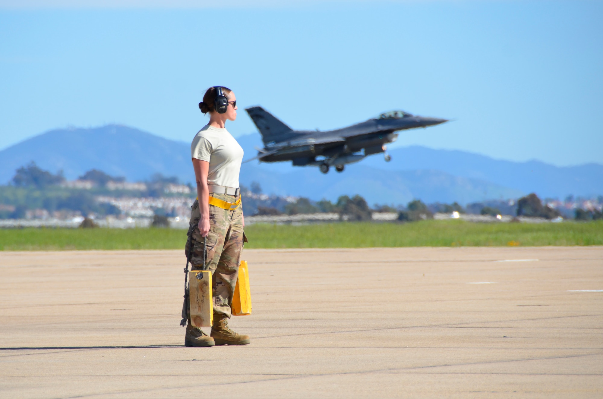 Tech. Sgt. Emma Stevens, Armament Systems Specialist with the 114th Aircraft Maintenance Squadron, waits to conduct a post-flight review of F-16Cs during Lobo Plummet at Marine Corps Air Station Miramar, California, March 2019.