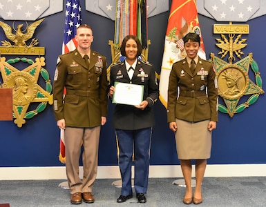 Command Sgt. Major of the Army Daniel A. Daily (left) and Command Sgt. Major Tabitha A. Gavia (right) U.S. Army Recruiting Command, recognize Sgt. 1st Class Ebony R. Thomas-Yarborough, Park North Station Commander, for her efforts leading her team of recruiters who put 51 individuals in the Army Between January and March 2019.