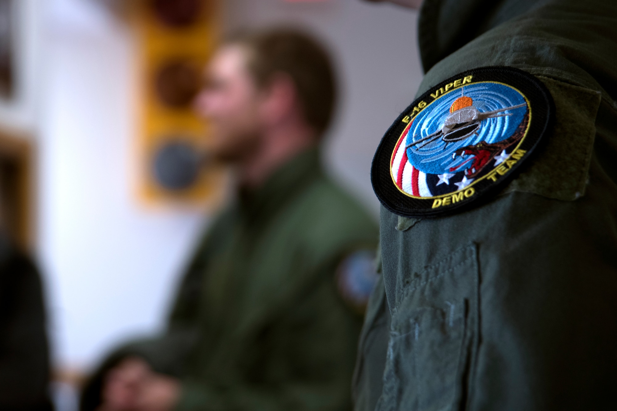 An F-16 Viper Demonstration Team patch rests on the shoulder of Townsend Bell, sports commentator and professional race car driver, at Shaw Air Force Base, S.C., April 16, 2019.