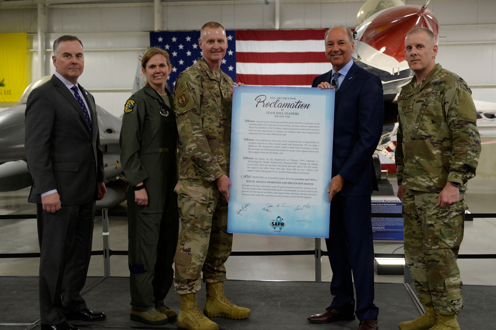 Leadership following their signing of a Sexual Assault Awareness and Prevention Month (SAAPM) proclamation during the base’s SAAPM breakfast April 16, 2019, at Hill Air Force Base, Utah. From left to right: Eric Fox, Ogden Air Logistics Complex vice director, Col. Regina Sabric, 419th Fighter Wing commander, Col. Jon Eberlan, 75th Air Base Wing commander, Thomas Tremblay, guest speaker for the breakfast, and Chief Master Sgt. Christopher Walker, 75th ABW command chief. (U.S. Air Force photo by David Perry)