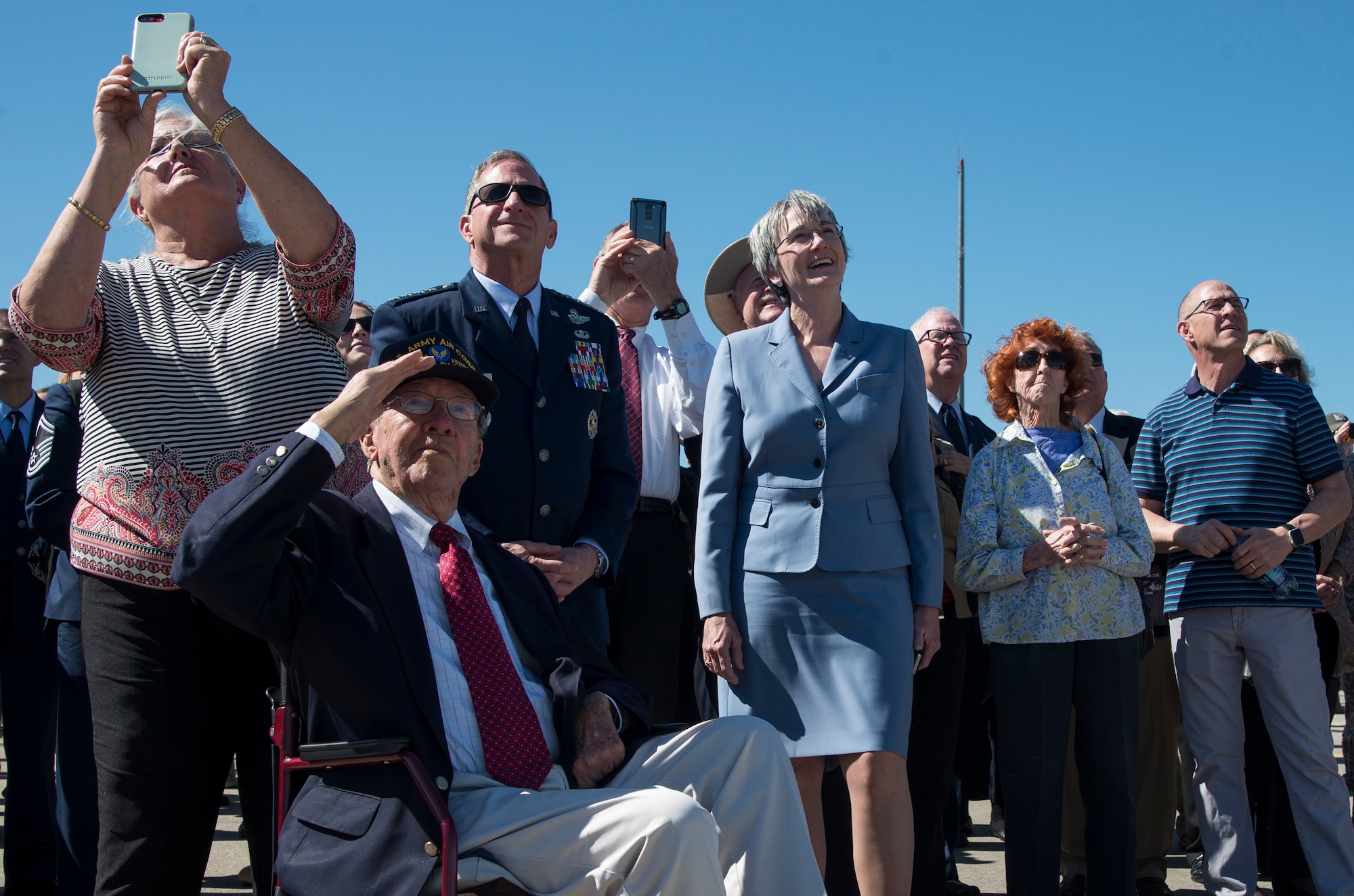 The family of retired U.S. Air Force Lt. Col. Richard “Dick” E. Cole, Chief of Staff of the Air Force General Goldein, and Secretary of the Air Force Heather Wilson watch the T-38C Talon Missing Man flyover during a memorial service celebrating Cole's life at Joint Base San Antonio-Randolph, Texas, April 18, 2019.