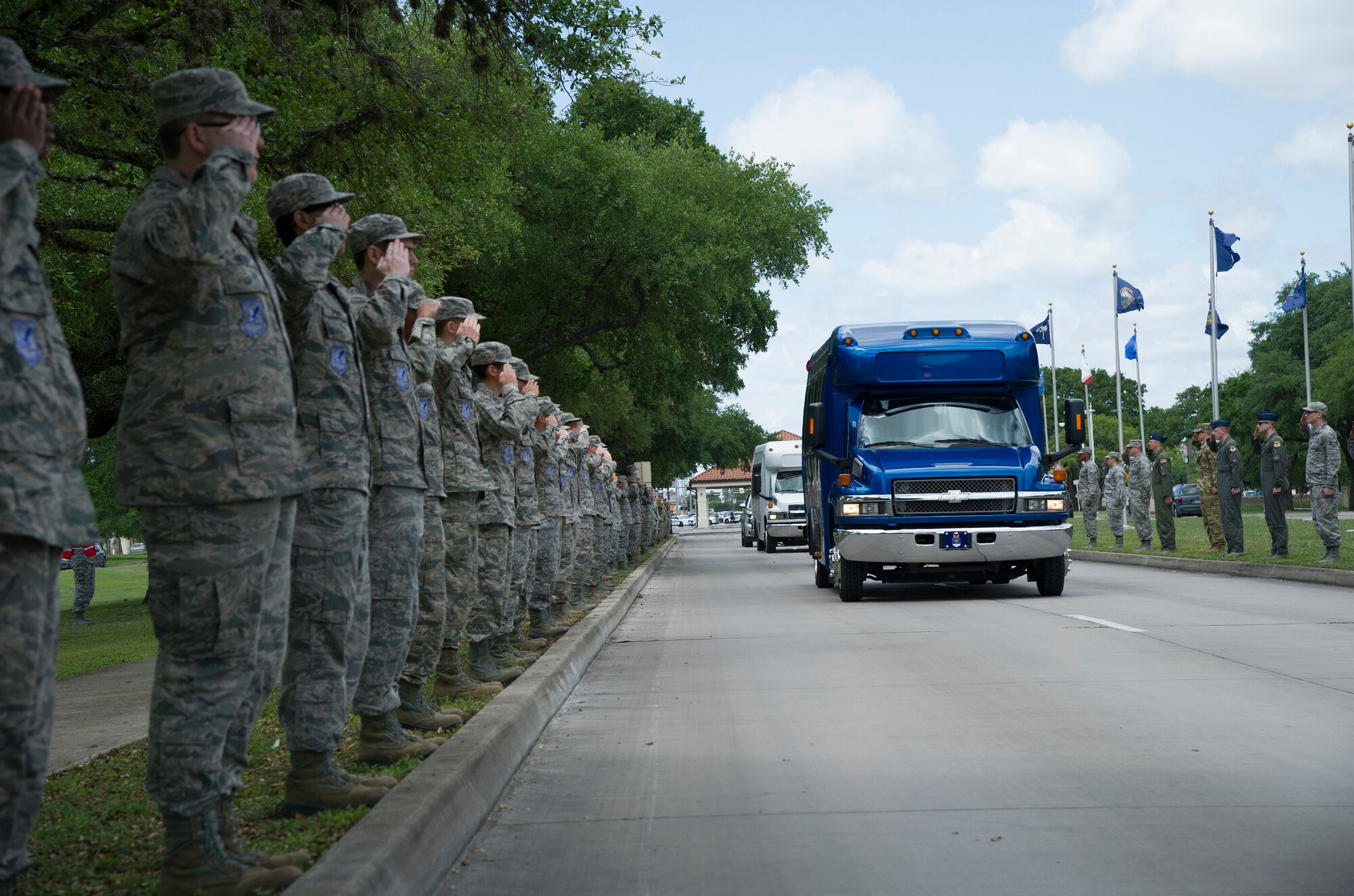 Airmen from Joint Base San Antonio-Randolph, Texas, line up to form a welcome cordon to greet the family of retired U.S. Air Force Lt. Col. Richard “Dick” E. Cole on their arrival to the base for Cole’s memorial ceremony April 18, 2019.