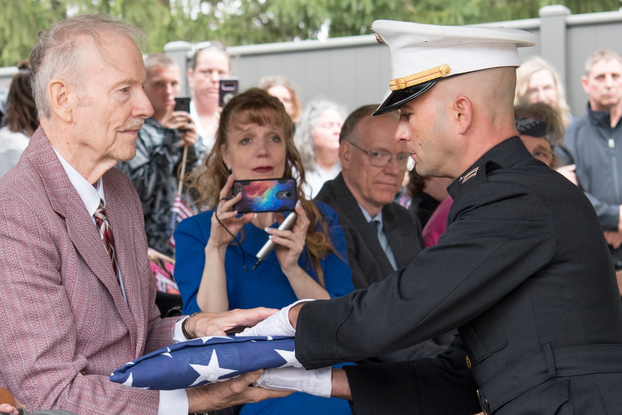 Capt. Pierce Virag, Detachment 1, Communications Company, Combat Logistics Regiment 45, 4th Marine Logistics Group, inspector instructor, presents the American flag to Roger Covey during the funeral of Pvt. Fred Freet April 18, 2019 at the Marion Indiana National Cemetery. The funeral was attended by multiple family members, military organizations, the Marion City Fire, Police and Sheriff’s Department and veterans who came to pay their respect. (U.S. Air Force Photo/Master Sgt. Ben Mota)