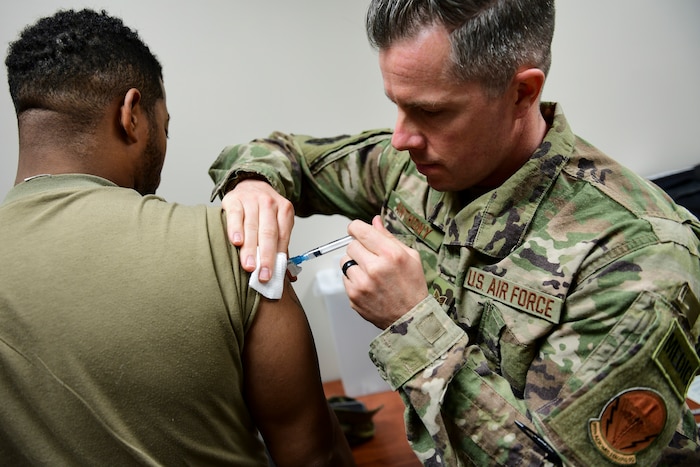 U.S. Air Force Tech Sgt. Joseph Anthony, medical technician with the 911th Aeromedical Staging Squadron, administers a vaccination to a member of the U.S. Army Reserve’s 336 Engineering Company Command and Control, Chemical Radiological and Nuclear Response Enterprise Team at the Pittsburgh International Airport Air Reserve Station, Pennsylvania, April 11, 2019. Department of Defense issued vaccinations are used to prevent a variety of diseases that military members may encounter in the course of their duties. (U.S. Air Force photo by Joshua J. Seybert)