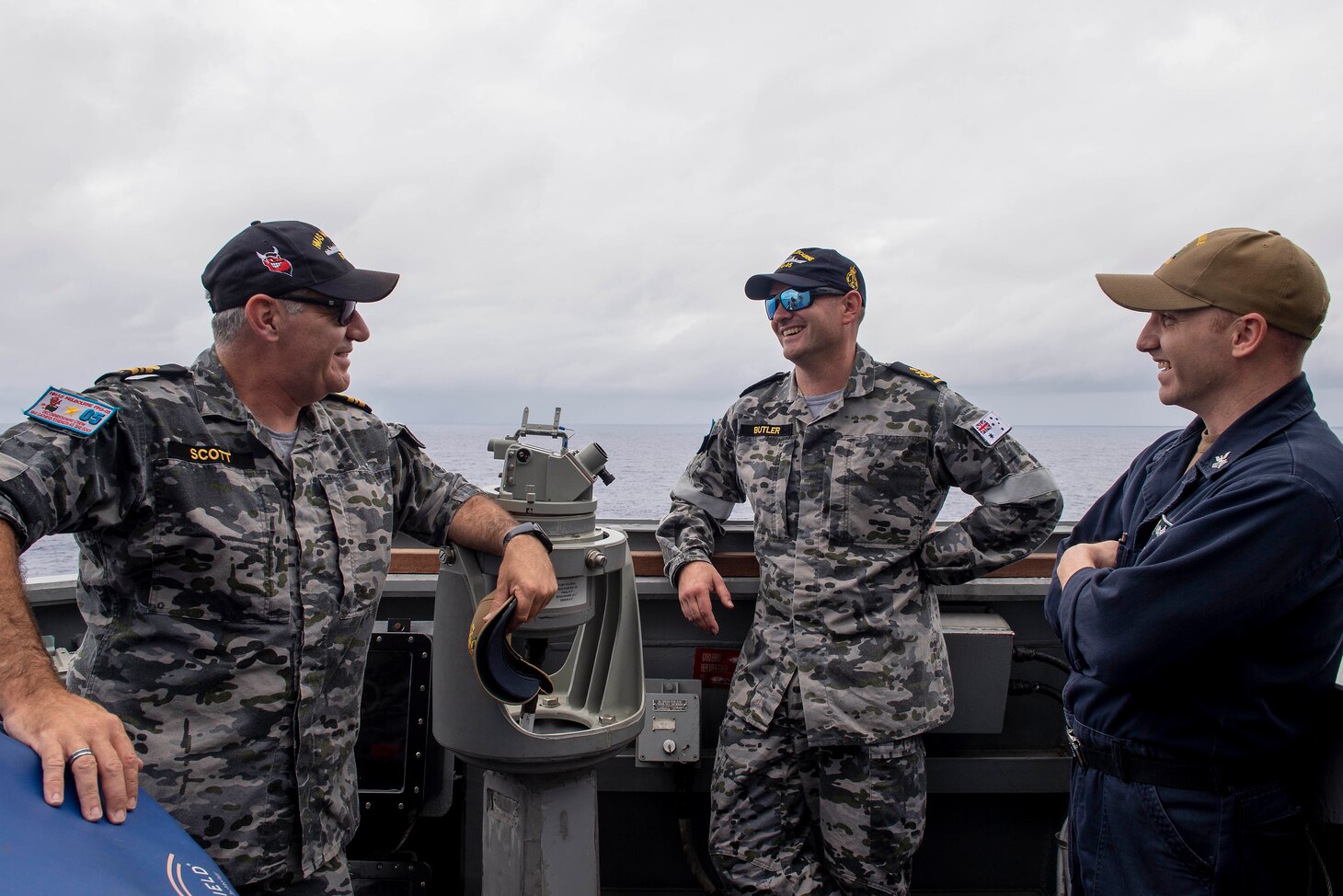 PHILIPPINE SEA (April 18, 2019) U.S. Navy Sailors and Royal Australian Navy sailors discuss the cooperative deployment and similarities between partner Navies aboard the Arleigh Burke-class guided-missile destroyer USS Preble (DDG 88) during a cooperative deployment. Preble is participating in a cooperative deployment with the Adelaide-class guided-missile frigate of the Australian Royal Navy HMAS Melbourne (FFG-05) in order to improve on maritime capabilities between partners.  Preble is deployed to the U.S 7th Fleet area of operations in support of security and stability in the Indo-Pacific region.