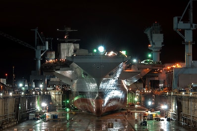The aircraft carrier Gerald R. Ford (CVN 78) under construction in a night photo at Newport News Shipbuilding, 10/7/2013.  The Ford is the first ship of a class of new aircraft carriers being built at Newport News Shipbuilding for the U. S. Navy.  John Whalen, Newport News Shipbuilding