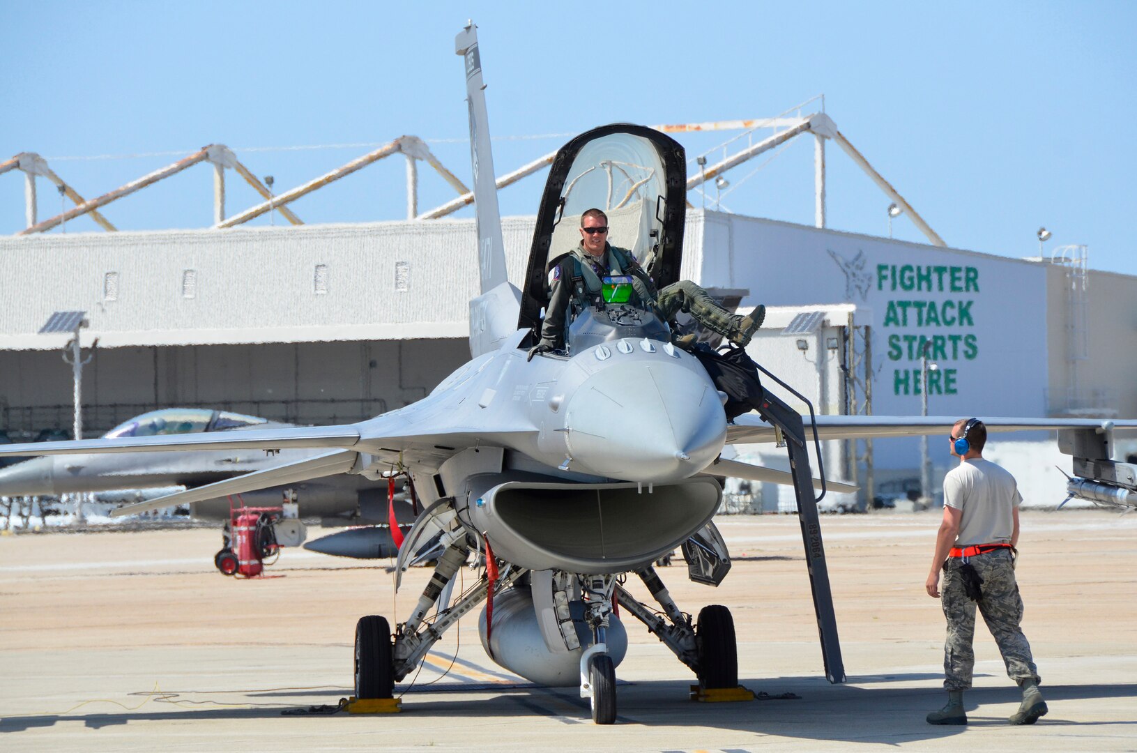 Maj. Ryan Stott, a pilot with the 114th Fighter Wing, exits an F-16C Fighting Falcon during Lobo Plummet at Marine Corps Air Station Miramar, California, March 2019. Lobo Plummet is a deployment for training that enables the 114th Fighter Wing to conduct force integration with fourth and fifth generation fighter aircraft.
