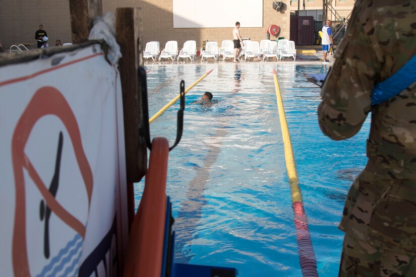 United States service members and coalition forces participate in the swim event of the German Armed Forces Badge (GAFB) for Military Proficiency on April 8, 2019, at Camp Arifjan, Kuwait. During this event, competitors must swim 100 meters in uniform within four minutes and then remove their uniform in the deep end without support. U.S. Army Central hosts events such as the GAFB to enhance service member’s personal abilities to stay combat ready which improves overall capabilities.