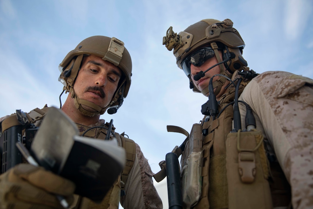 U.S. Marine Cpl. James Juarez, left, and Sgt. Nicholas Pirrone, Marines with the Maritime Raid Force, 22nd Marine Expeditionary Unit, review notes on a suspect during Visit, Board, Search and Seizure training aboard the Whidbey Island-class amphibious dock landing ship USS Fort McHenry (LSD-43). The Marines practiced boarding and searching a compliant vessel while implementing proper detainee handling. Marines and Sailors with the 22nd MEU and Kearsarge Amphibious Ready Group are currently deployed to the U.S. 5th Fleet area of operations in support of naval operations to ensure maritime stability and security in the Central Region, connecting the Mediterranean and the Pacific through the western Indian Ocean and three strategic choke points. (U.S. Marine Corps photo by Lance Cpl. Antonio Garcia/Released)
