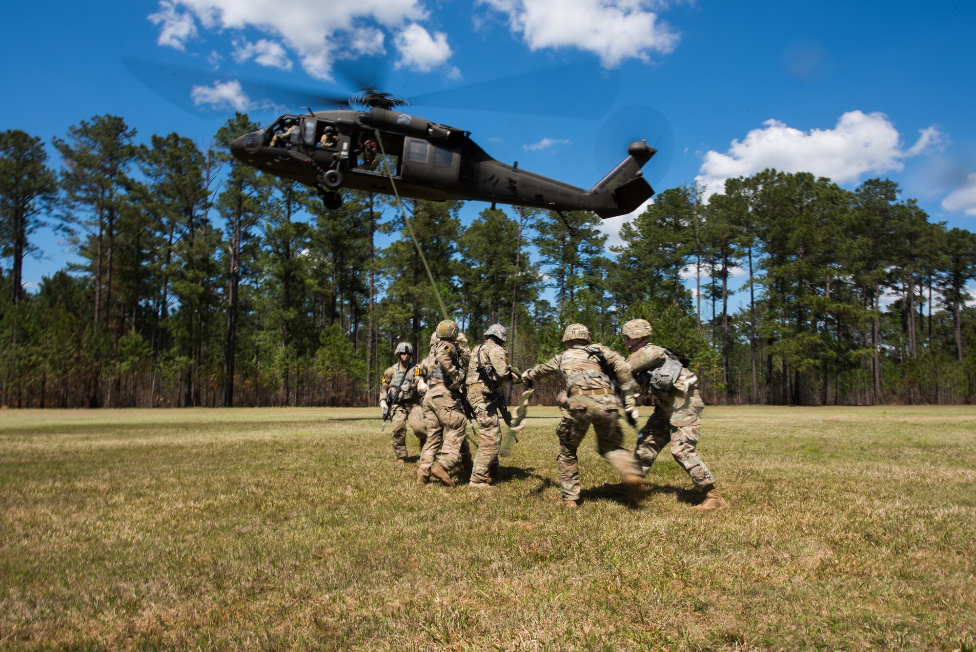 Airmen demonstrate Fast Rope Insertion Extraction System ability