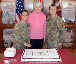 (From left) Capt. Kristin A. de Guzman, retired Col. Jessie Breuer and Col. Sara J. Spielmann at the cake-cutting ceremony at the U.S. Army Medical Department Center and School, Health Readiness Center of Excellence, or AMEDDC&S HRCoE, headquarters building at Joint Base San Antonio-Fort Sam Houston April 16.