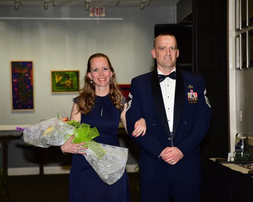Senior Master Sgt. Wade Steinback, 14th Flying Training Wing Maintenance Authority superintendent, and his wife, Katie Steinback, pose for a photo during his chief recognition ceremony April 12, 2019, at the Club on Columbus Air Force Base, Miss. Steinback was recognized for his selection to promote to chief master sergeant. (U.S. Air Force photo by Melissa Doublin)