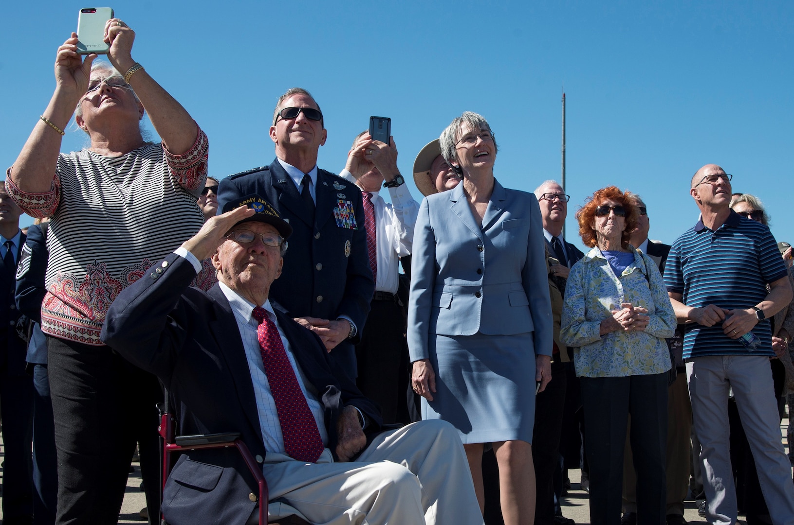 Secretary of the Air Force Heather Wilson, U.S. Air Force Chief of Staff Gen. David L. Goldfein and memorial attendees watch flyover during a memorial service celebrating the life of retired U.S. Air Force Lt. Col. Richard “Dick” E. Cole at Joint Base San Antonio-Randolph April 18. Cole, the last surviving Doolittle Raider, was the co-pilot on a B-25 Mitchell for then-Col. Jimmy Doolittle during the storied World War II Doolittle Tokyo Raid.