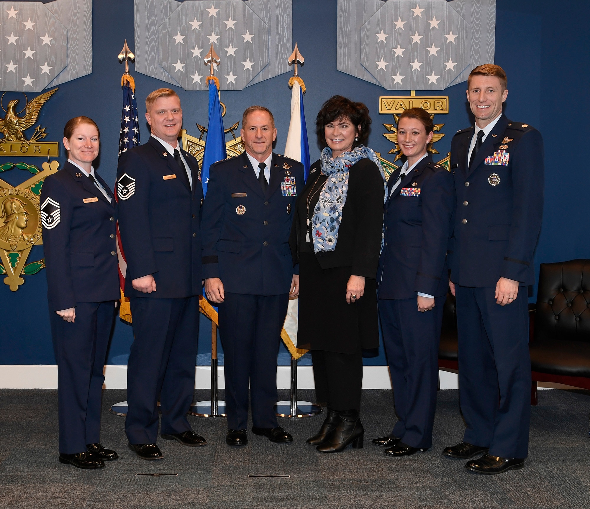 Senior Master Sgt. Alison Middleton, Master Sgt. Joshua Phillips, Capt. M. Helen Marino and Lt. Col. Mark Garlow, recipients of the 2017 Lance P. Sijan award, stand with Air Force Chief of Staff Gen. David L. Goldfein and Ms. Janine Sijan-Rozina at the Pentagon, in Arlington, Va., April 17, 2019. Sijan was the first Air Force Academy graduate to receive the Medal of Honor for his bravery and courage while evading capture and during his subsequent captivity as a prisoner of war after being shot down over Vietnam on Nov. 9, 1967. (U.S. Air Force photo by Andy Morataya)