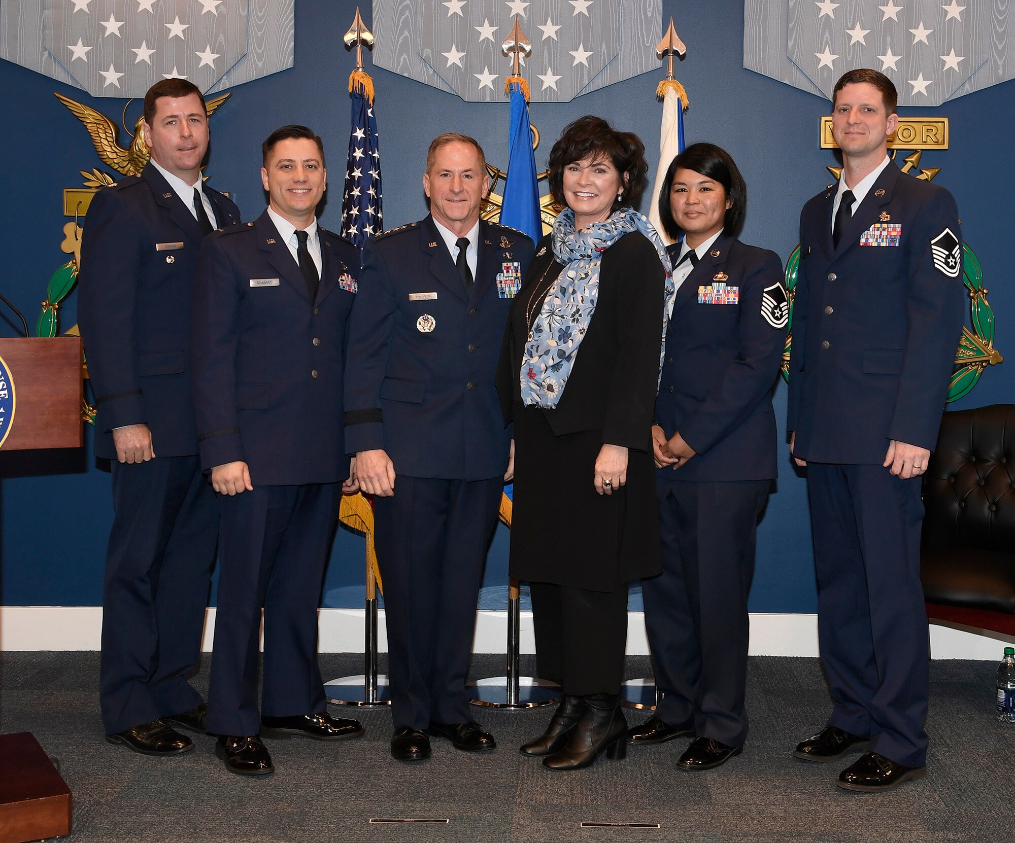 Lt. Col.  Martin O'Brien, 1st Lt. Jason Quadros, Master Sgt. Veronica Babauta and Master Sgt. Robert Perz, recipients of the 2018 Lance P. Sijan award, stand with Air Force Chief of Staff Gen. David L. Goldfein and Ms. Janine Sijan-Rozina at the Pentagon, in Arlington, Va., April 17, 2019. Sijan was the first Air Force Academy graduate to receive the Medal of Honor for his bravery and courage while evading capture and during his subsequent captivity as a prisoner of war after being shot down over Vietnam on Nov. 9, 1967. (U.S. Air Force photo by Andy Morataya)