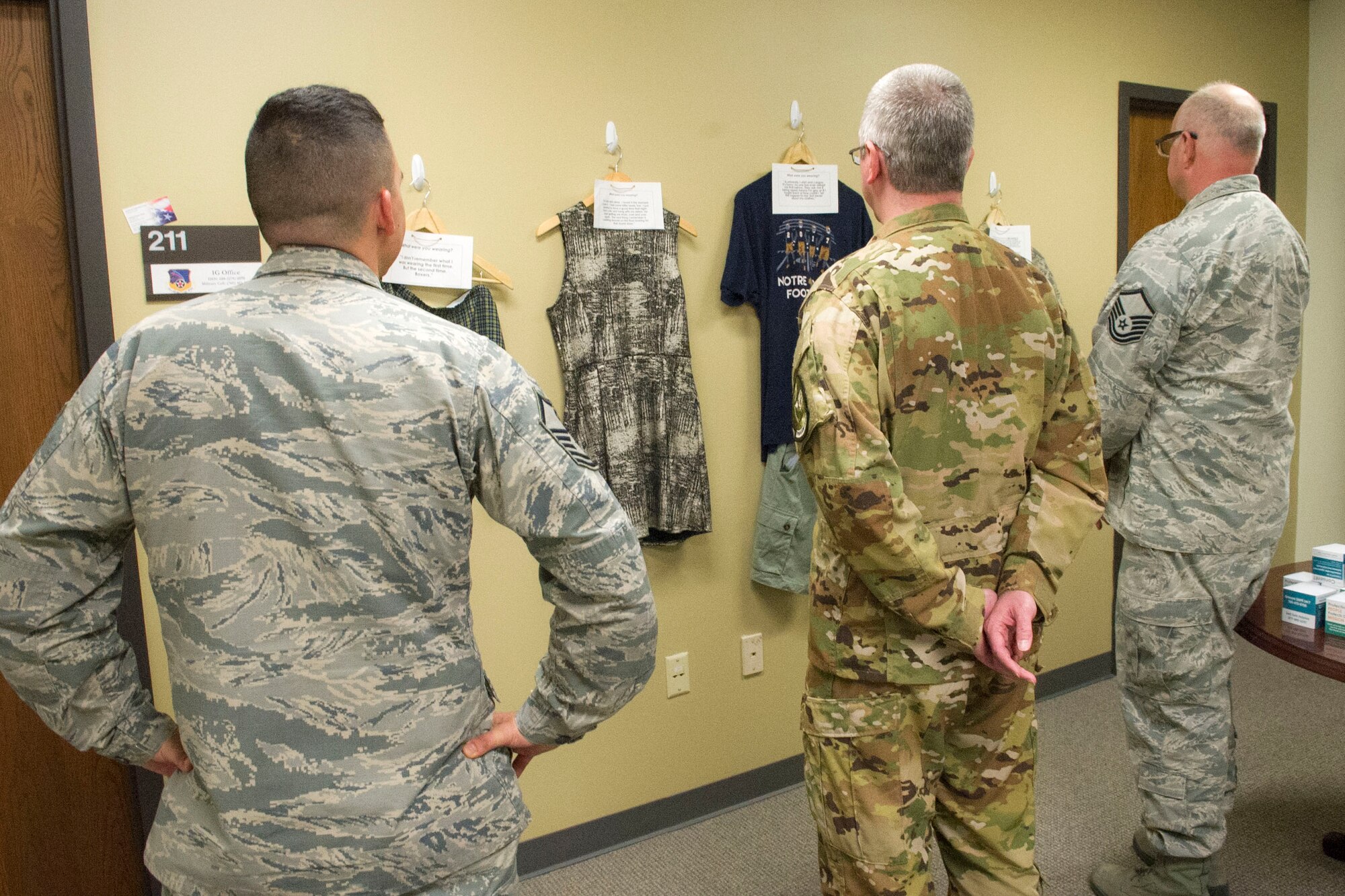 Members from the 434th Air Refueling Wing visit the “What Were You Wearing” art illustration at Grissom Air Reserve Base, Ind., April 19, 2019 in building 596. The display first debuted at the University of Arkansas in 2014 and is designed to challenge victim blaming based on the myth that clothing causes sexual violence. 
(U.S. Air Force photo by Staff Sgt. Courtney Dotson-Essett)