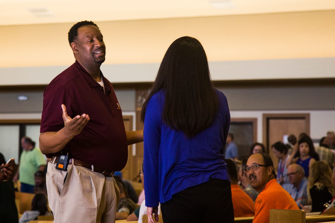 Nathan Taylor, program manager for Workforce Development, Manpower and Reserve Affairs, Headquarters, U.S. Marine Corps, meets with a civilian Department of Defense employee during the WESTPAC Civilian Career Development Information Forum, Marine Corps Base Hawaii (MCBH), Apr. 18, 2019. The WESTPAC Civilian Career Development Information Forum provided Civilian Marines aboard the installation with information to increase their professional knowledge and hear the latest news regarding civilian workforce development policies, programs, and opportunities. (U.S. Marine Corps photo by Cpl. Luke Kuennen)