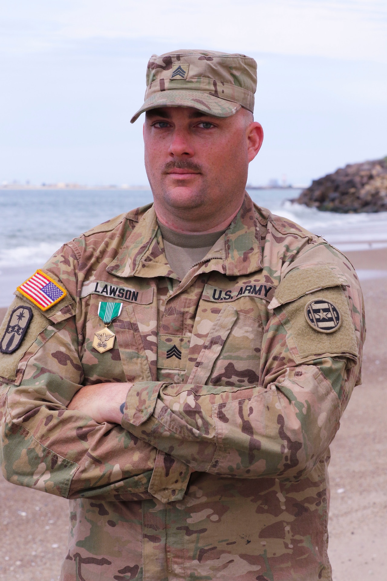 Army Reserve Sgt. James Lawson poses on a Port Hueneme, Calif. beachhead after a ceremony in which he was awarded the Army Commendation Medal April 5, 2019.