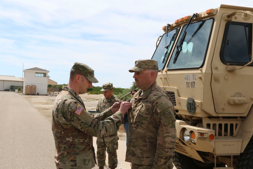 Capt. Schuyler Wessels, commander of the of the 481st Transportation (Heavy Boat) Company, 3rd Transportation Command (Expeditionary), pins the Army Commendation Medal onto Sgt. James Lawson during a ceremony on Port Hueneme, Calif., April 5, 2019.