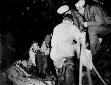 Two RAF flight crew members from a Mosquito bomber that crashed in the English Channel are rescued by the crew of a Coast Guard 83-foot cutter of Coast Guard Rescue Flotilla One.
