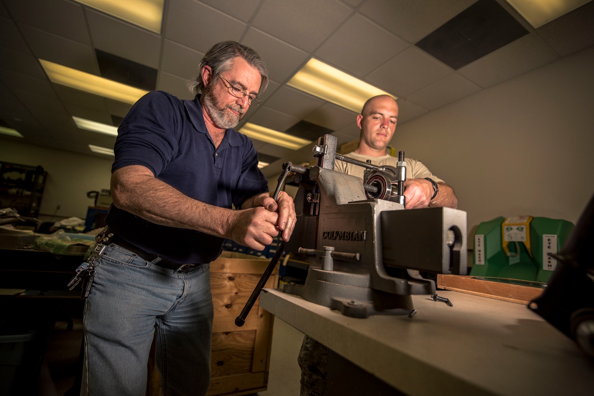 Everett Brooks, 2d Weather Squadron, Detachment 4, integrated systems mechanic, and Staff Sgt. Bradley Douglas, 2d WS, Det 4, central repair activity technician reassemble a right ascension drive roller, March 21, 2019, on Holloman Air Force Base, N.M. (U.S. Air Force photo by Staff Sgt. Christine Groening)