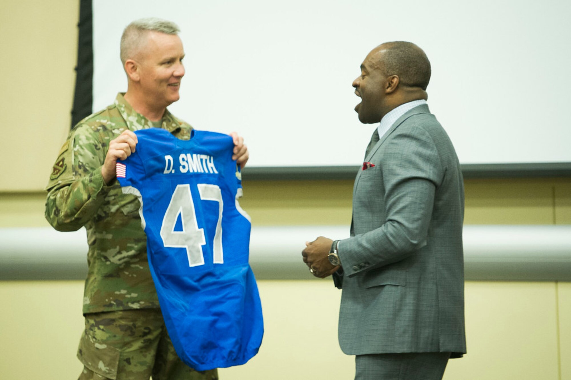 DeMaurice F. Smith, NFL Players Association executive director, shares a laugh with AFDW Commander Maj. Gen. James A. Jacobson, who presented him a custom-made Air Force Academy jersey during the 2019 AFDW Squadron Commander and Spouse Orientation Course at Joint Base Andrews, Maryland, April 17, 2009. (U.S. Air Force photo by Master Sgt. Michael B. Keller)