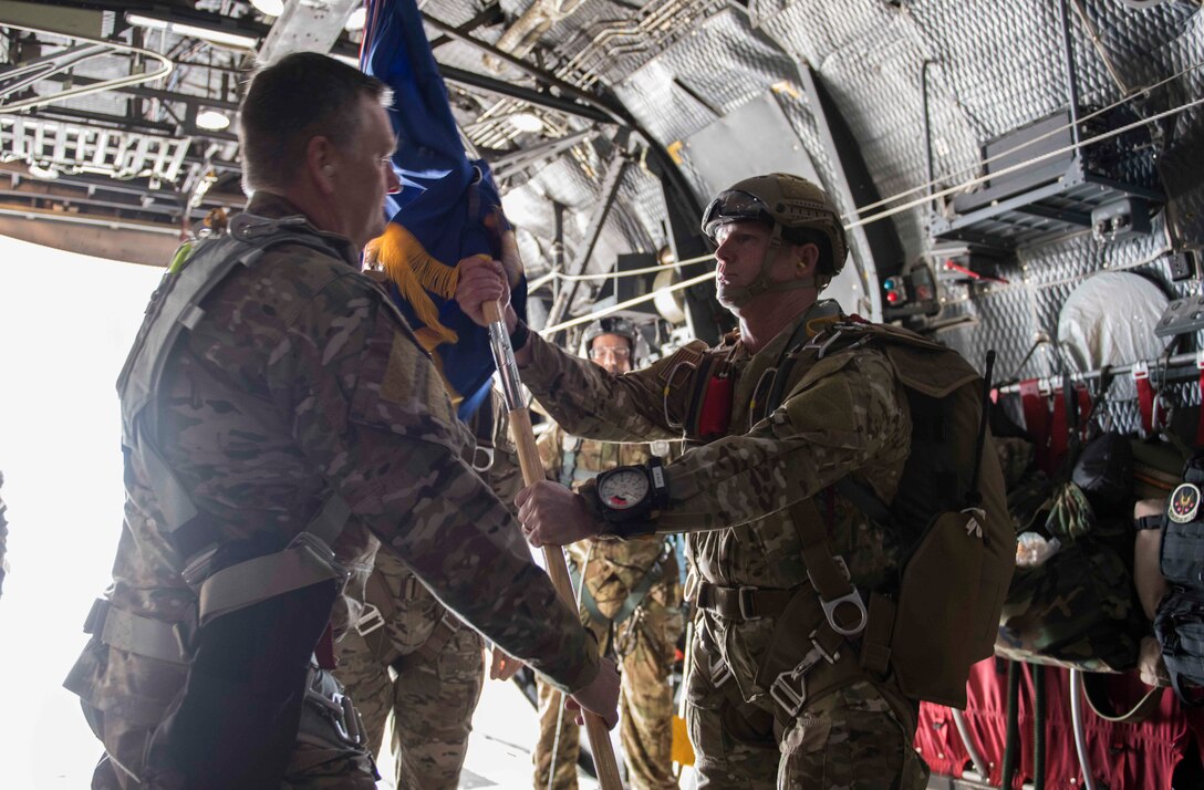 U.S. Air Force Brig. General Claude K. Tudor Jr., commander of the 24th Special Operations Wing, relinquishes command on the back of an MC-130H Combat Talon II, Hurlburt Field, Florida, April 19, 2019.