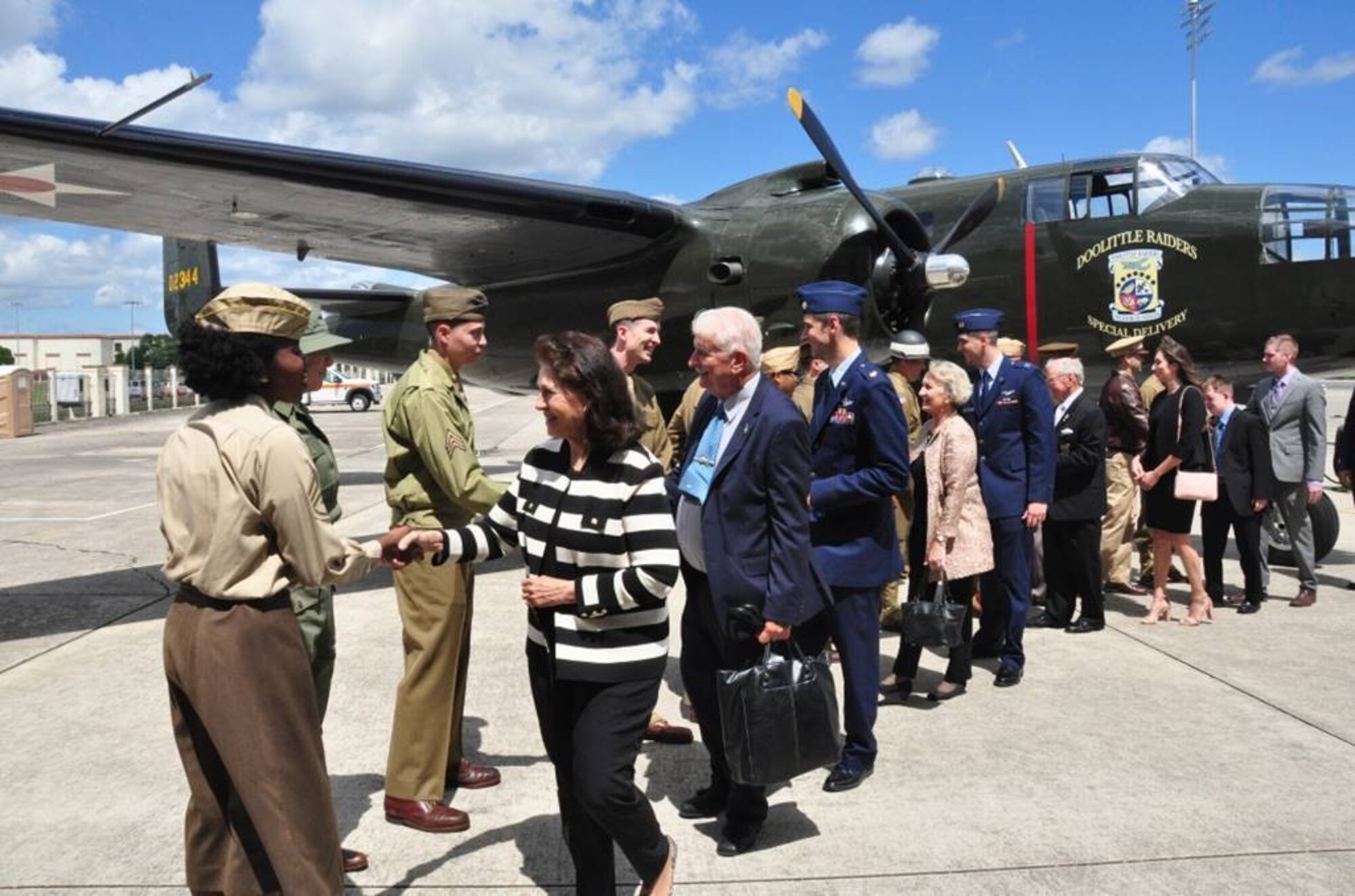 The family of retired Air Force Lt. Col. Richard “Dick” E. Cole look at a B-25 Mitchell static display during a memorial service for their father at Joint Base San Antonio-Randolph, Texas, April 18, 2019. Cole, the last surviving Doolittle Raider, was the co-pilot on a B-25 Mitchell for then Col. Jimmy Doolittle during the storied World War II Doolittle Tokyo Raid. (U.S. Air Force photo by Tech. Sgt. Ave Young)
