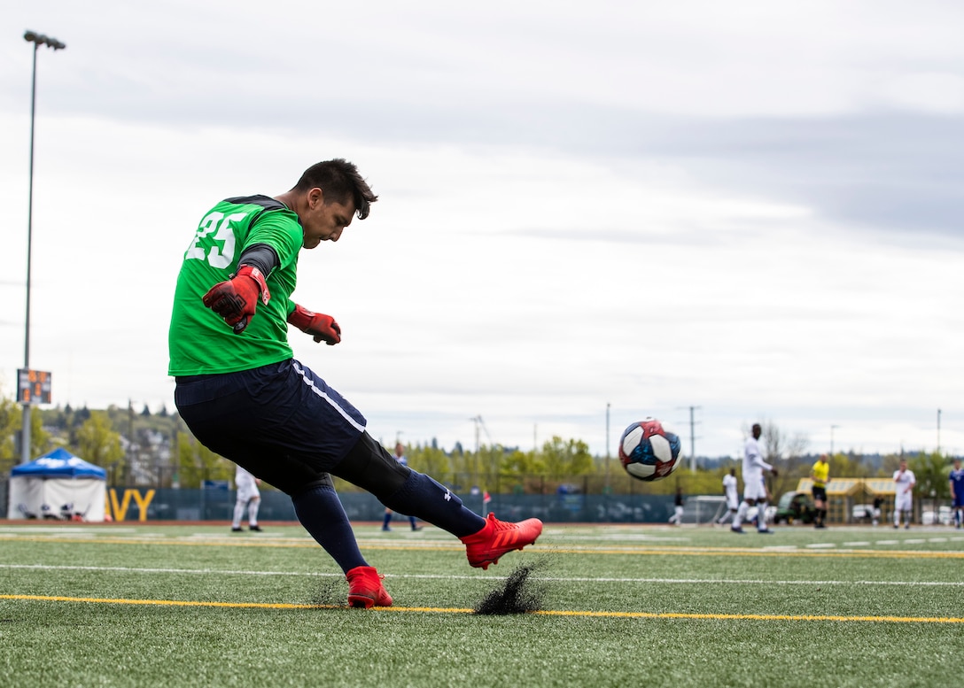 NAVAL STATION EVERETT, Wa. (April 18, 2019) -  Seaman Dylan Meeker, stationed at Naval Hospital Beauforte, S.C., kicks the ball downfield during a match agains the Air Force soccer team at the Armed Forces Sports Men’s Soccer Championship hosted at Naval Station Everett. (U.S. Navy Photo by Mass Communication Specialist 2nd Class Ian Carver/RELEASED).