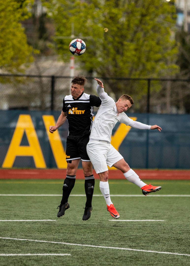 NAVAL STATION EVERETT, Wa. (April 18, 2019) - 1st Lt. Tanner Vosuick, station at Fort Jackson, S.C. competes for a ball against Capt. Dylan Montambo, stationed at Camp Lejeune, N.C., at the Armed Forces Sports Men’s Soccer Championship hosted at Naval Station Everett. (U.S. Navy Photo by Mass Communication Specialist 2nd Class Ian Carver/RELEASED).