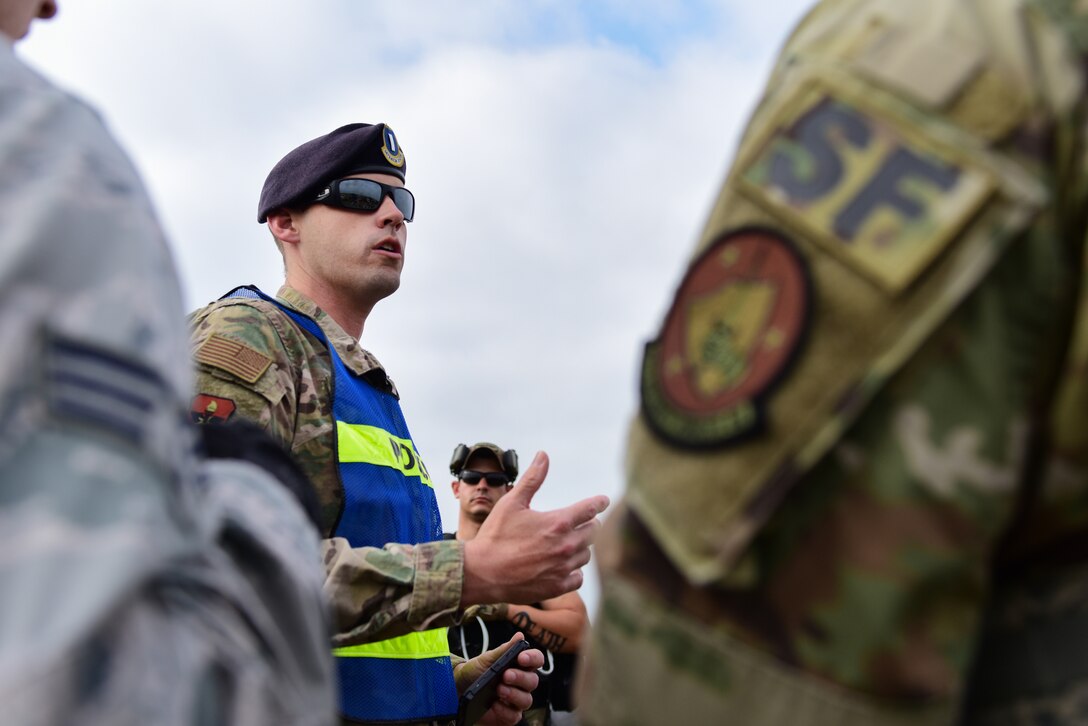 First Lt. Wayne Fultz, 47th Security Forces operations officer, briefs Laughlin Defenders as they prepare for an exercise at Laughlin Air Force Base, Texas, April 17, 2019. Starting early, the defenders trekked through the base’s farthest corners, fighting off a simulated enemy with their sights set on sharpening their tactics as a unit. (U.S. Air Force photo by Senior Airman Benjamin N. Valmoja)
