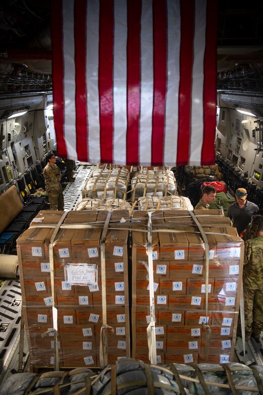 World Food Programme food and supplies are loaded in a C-17 Globemaster III assigned to the 16th Airlift Squadron, Joint Base Charleston, Charleston, South Carolina, supporting Combined Joint Task Force-Horn of Africa, in Maputo, Mozambique, April 2, 2019. The task force is helping meet requirements identified by the United States Agency for International Development (USAID) assessment teams and humanitarian organizations working in the region by providing logistics support and manpower to USAID at the request of the Government of the Republic of Mozambique. (U.S. Air Force Photo by Tech. Sgt. Chris Hibben)