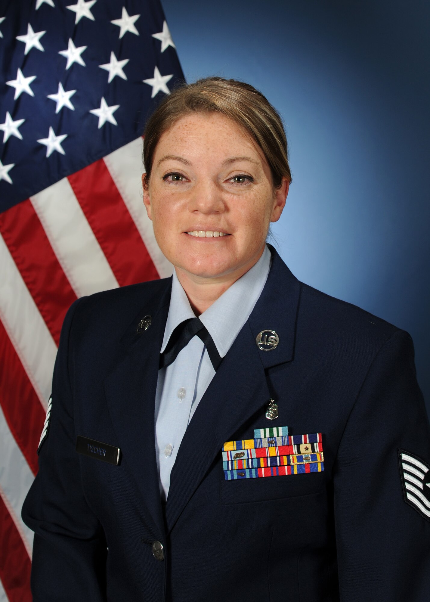 Tech. Sgt. Lindsey Tischer, 737th Training Support Squadron NCO in charge of bravo dispensary and independent duty medical technician, poses for a photo.