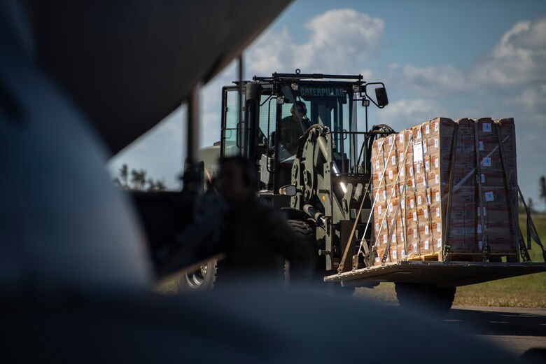 U.S. military personnel unload a C-17 Globemaster III assigned to the 16th Airlift Squadron, Joint Base Charleston, Charleston, South Carolina, supporting Combined Joint Task Force-Horn of Africa, in Beira, Mozambique, April 2, 2019. The task force is helping meet requirements identified by the United States Agency for International Development (USAID) assessment teams and humanitarian organizations working in the region by providing logistics support and manpower to USAID at the request of the Government of the Republic of Mozambique. (U.S. Air Force Photo by Tech. Sgt. Chris Hibben)