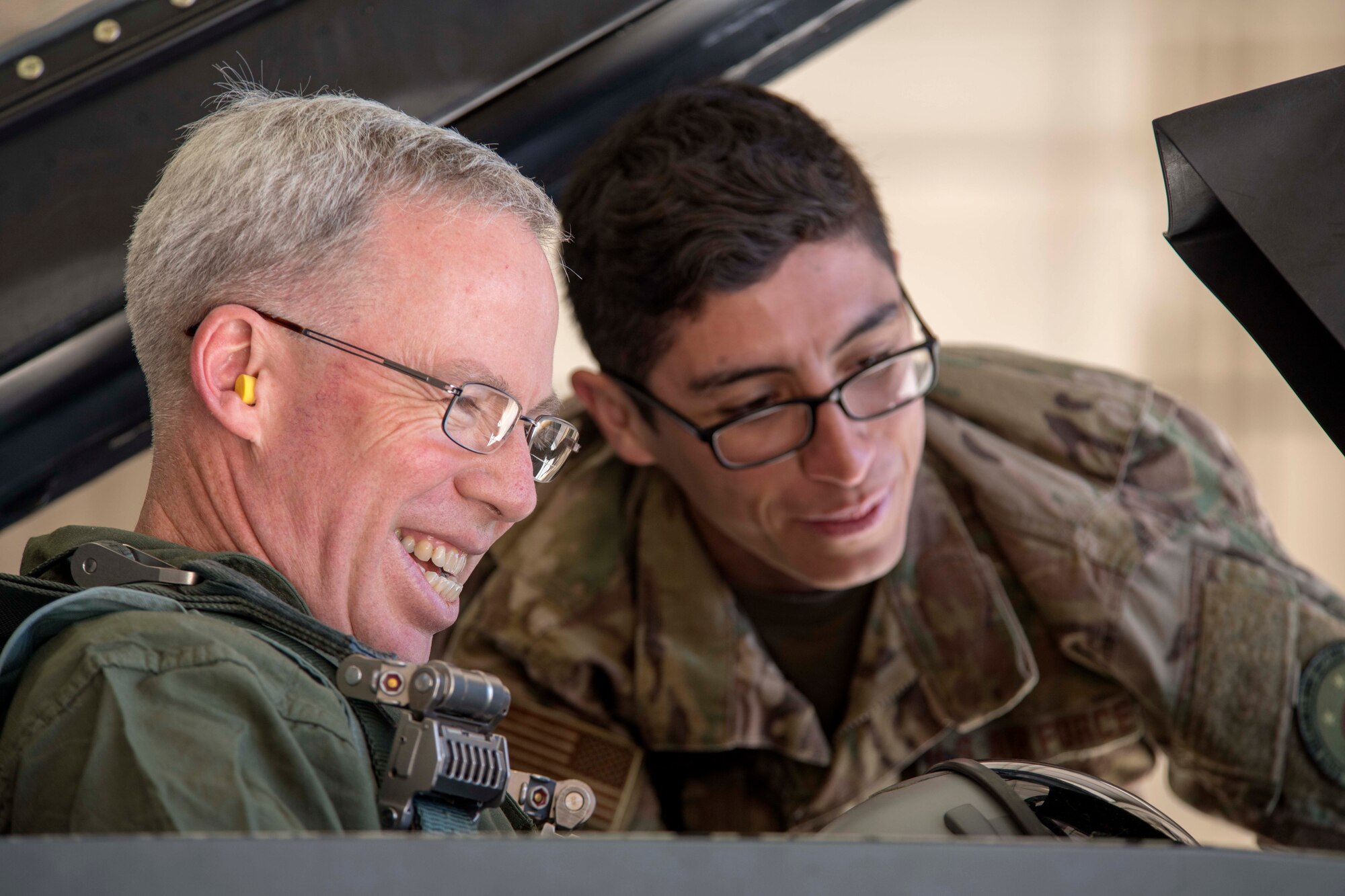 Senior Airman Kevin Turcios, 849th Aircraft Maintenance Squadron Dedicated Crew Chief, assists U.S. Army Brig. Gen. Gregory Brady, White Sands Missile Range commander, into an F-16 Fighting Falcon, April 19, 2019, on Holloman Air Force Base, N.M. Brady visited Holloman to gain a better understanding of the base’s overall mission. (U.S. Air Force photo by Staff Sgt. Christine Groening)
