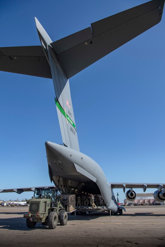 U.S. military personnel unload a C-17 Globemaster III assigned to the 16th Airlift Squadron, Joint Base Charleston, Charleston, South Carolina, supporting Combined Joint Task Force-Horn of Africa, in Beira, Mozambique, April 2, 2019. The task force is helping meet requirements identified by the United States Agency for International Development (USAID) assessment teams and humanitarian organizations working in the region by providing logistics support and manpower to USAID at the request of the Government of the Republic of Mozambique. (U.S. Air Force Photo by Tech. Sgt. Chris Hibben)
