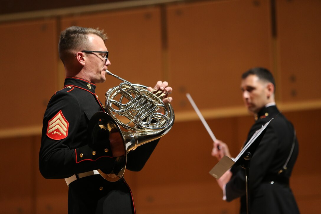 Sergeant John Brilhart, a musician with Marine Band San Diego, performs a solo at the Illinois State University Center for the Performing Arts during a tour of the Midwest. The band performs at more than 350 appearances per year. The band performs every Friday at Marine Corps Recruit Depot San Diego, California when they are not on tour. (Official U.S. Marine Corps photo by Sgt Calvin Hilt)