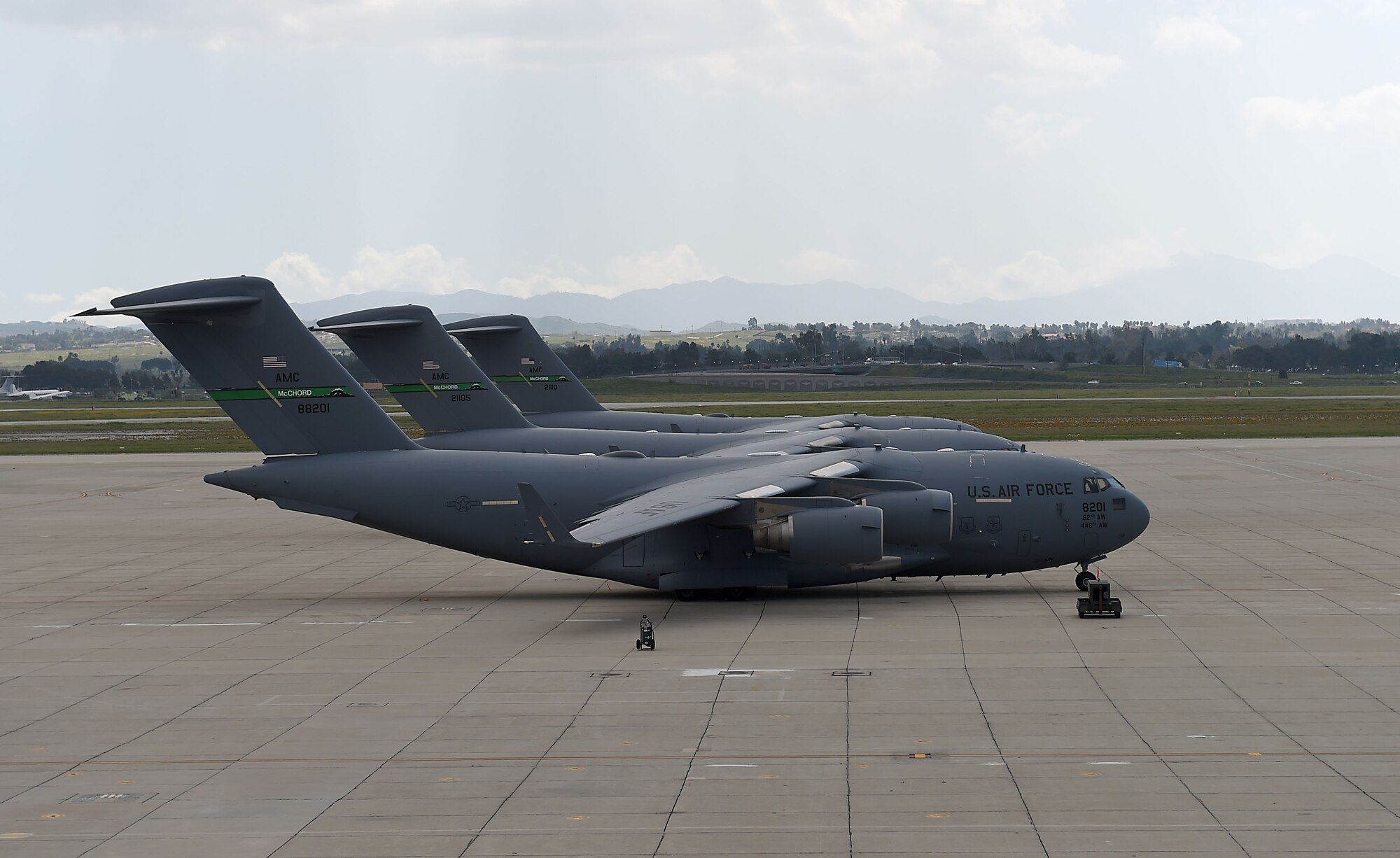 Three McChord C-17 Globemaster III aircraft sit on the March Air Reserve Base flightline in California, April 1, 2019. During the McChord flightline closure for repairs, March-June, 2019.