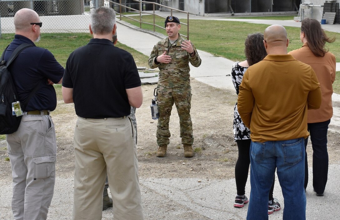 Master Sgt. Steve Kaun, Air Force Military Working Dog Program Manager, gives the government-wide working dog team members a tour of 341st Training Squadron’s military working dog kennels on Joint Base San Antonio-Lackland April 16. The 341st TRS provides training to MWDs used in patrol, drug and explosive detection, and specialized mission functions for the Department of Defense and other government agencies.