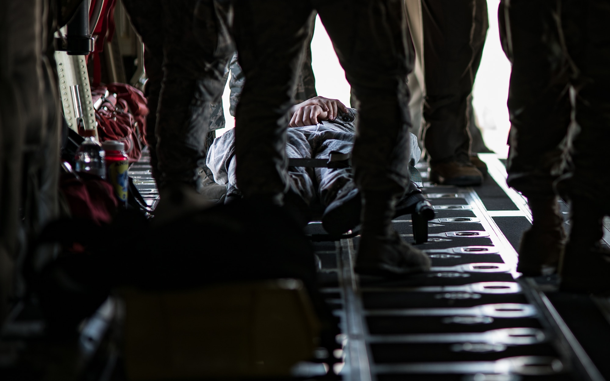 374th Medical Group personnel practice loading patients onto a C-130J Hercules on the Yokota Air Base, Japan, flightline April 18, 2019, as part of patient movement air evacuation training. The training took place as part of a larger, group-wide training day that included various potential crises. (U.S. Air Force Photo by Staff Sgt. Kyle Johnson)