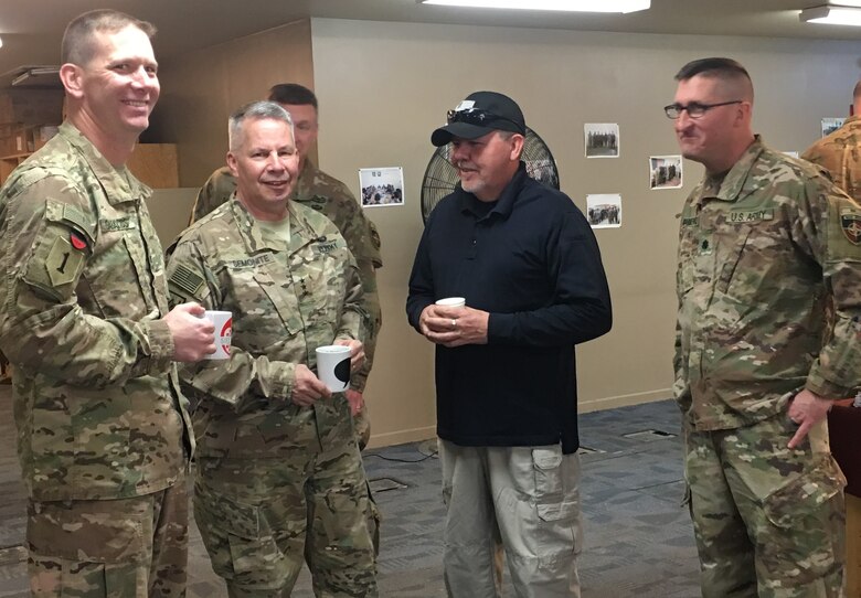 General Semonite engages in some conversation and coffee during his visit with the Parwan Prison team members.