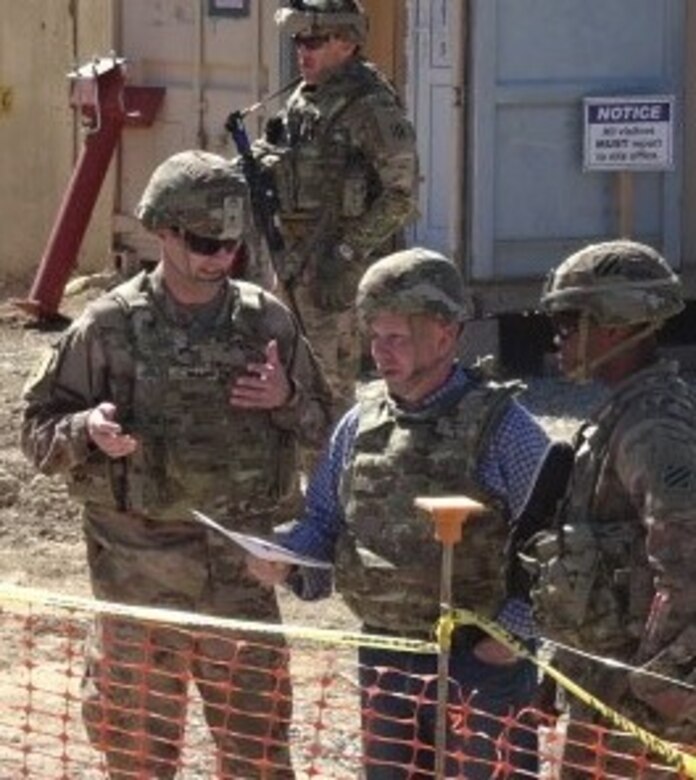 Major Rich Mahn, Military Deputy DPM for USACE Afghanistan and CPT Jamar Littlejohn, Task Force Warrior Battalion Engineer brief General Semonite on the enhancements to security capabilities during a final project visit before he got on a plane to head back to Washington.