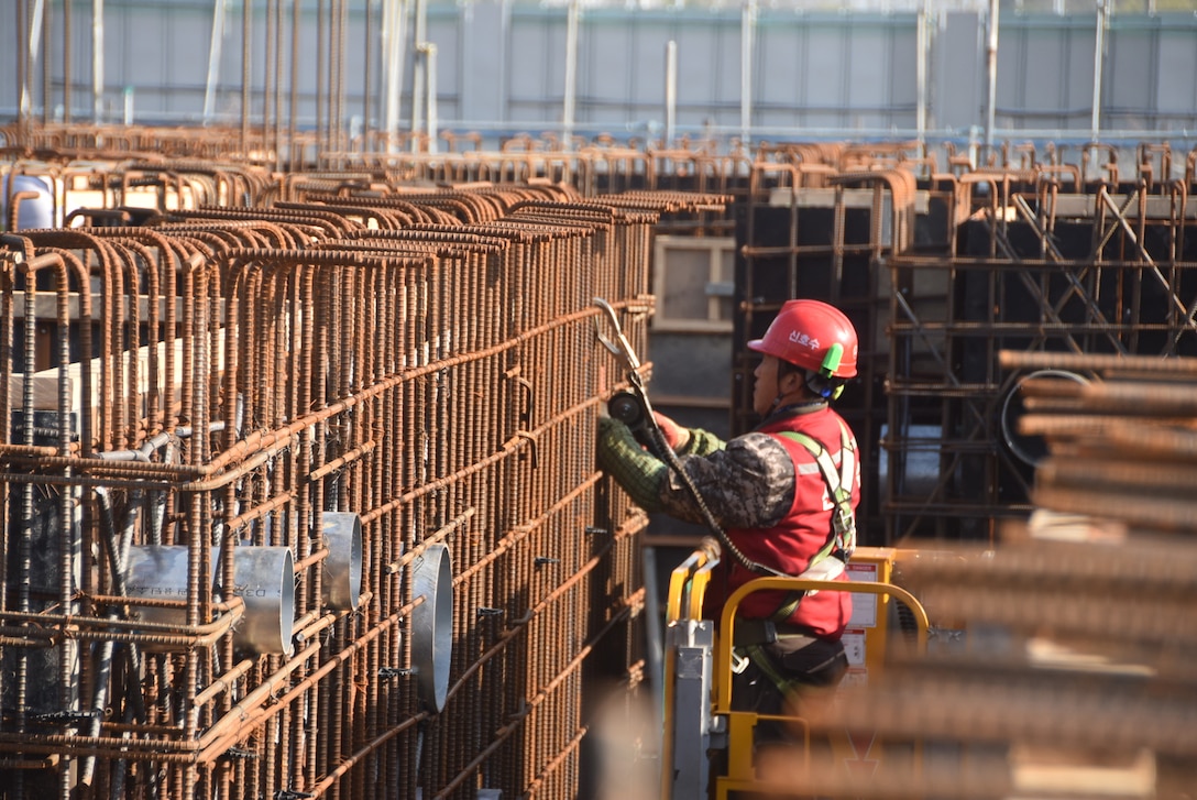A construction worker from a Korean contracting firm performs work at one of the many construction projects overseen by the far East District.