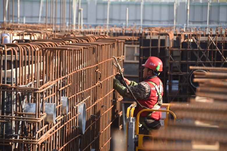 A construction worker from a Korean contracting firm performs work at one of the many construction projects overseen by the far East District.