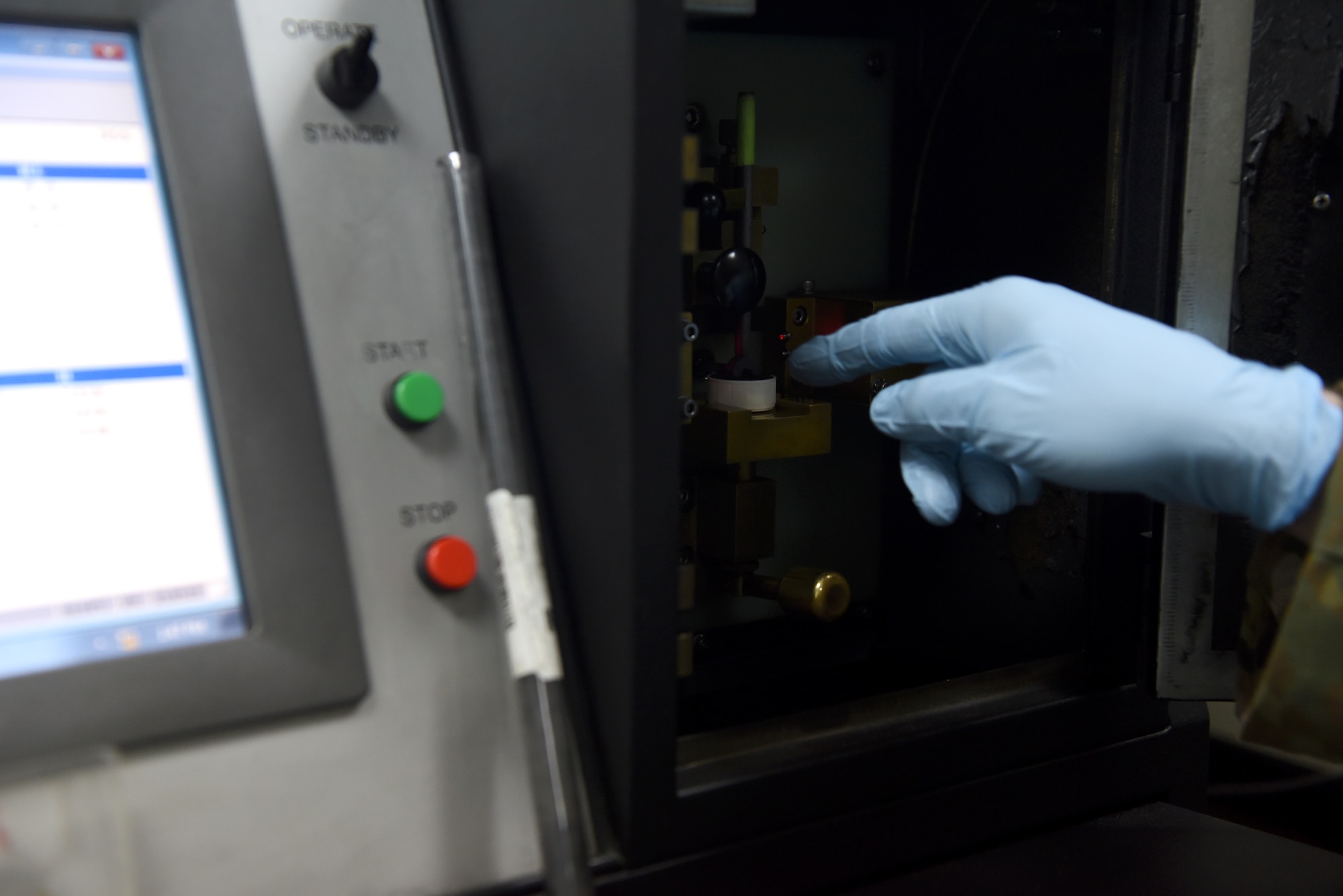 Senior Airman Jared Allen, 380th Expeditionary Maintenance Squadron Nondestructive Inspection journeyman, uses a controlled sample to demonstrate how to run a Joint Oil Analysis Program, April 12, 2019, on Al Dhafra Air Base, United Arab Emirates.