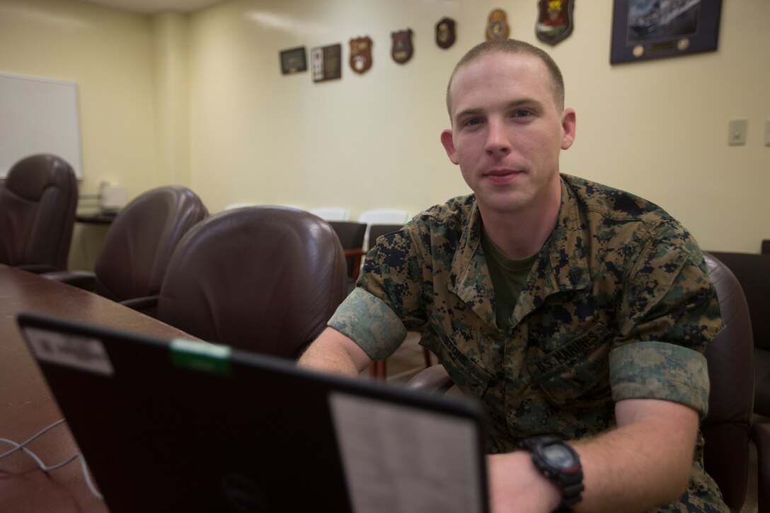 Cpl. John Stone, a meteorology and oceanography analyst forecaster with the 31st Marine Expeditionary Unit, uses a computer at Camp Hansen, Okinawa, Japan, April 16, 2019.
