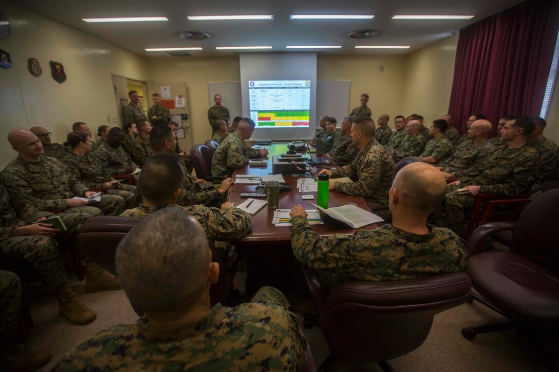 Col. Robert Brodie, commanding officer of the 31st Marine Expeditionary Unit, and Sgt. Maj. Edwin Mota, 31st MEU sergeant major, listen in on a confirmation brief during MEU Exercise at Camp Hansen, Okinawa, Japan, Dec. 12, 2018. The 31st MEU, the Marine Corps’ only continuously forward-deployed MEU, provides a flexible force ready to perform a wide range of military operations as the premier crisis response force in the Indo-Pacific Region. (U.S. Marine Crops photo by Lance Cpl. Cameron Parks)